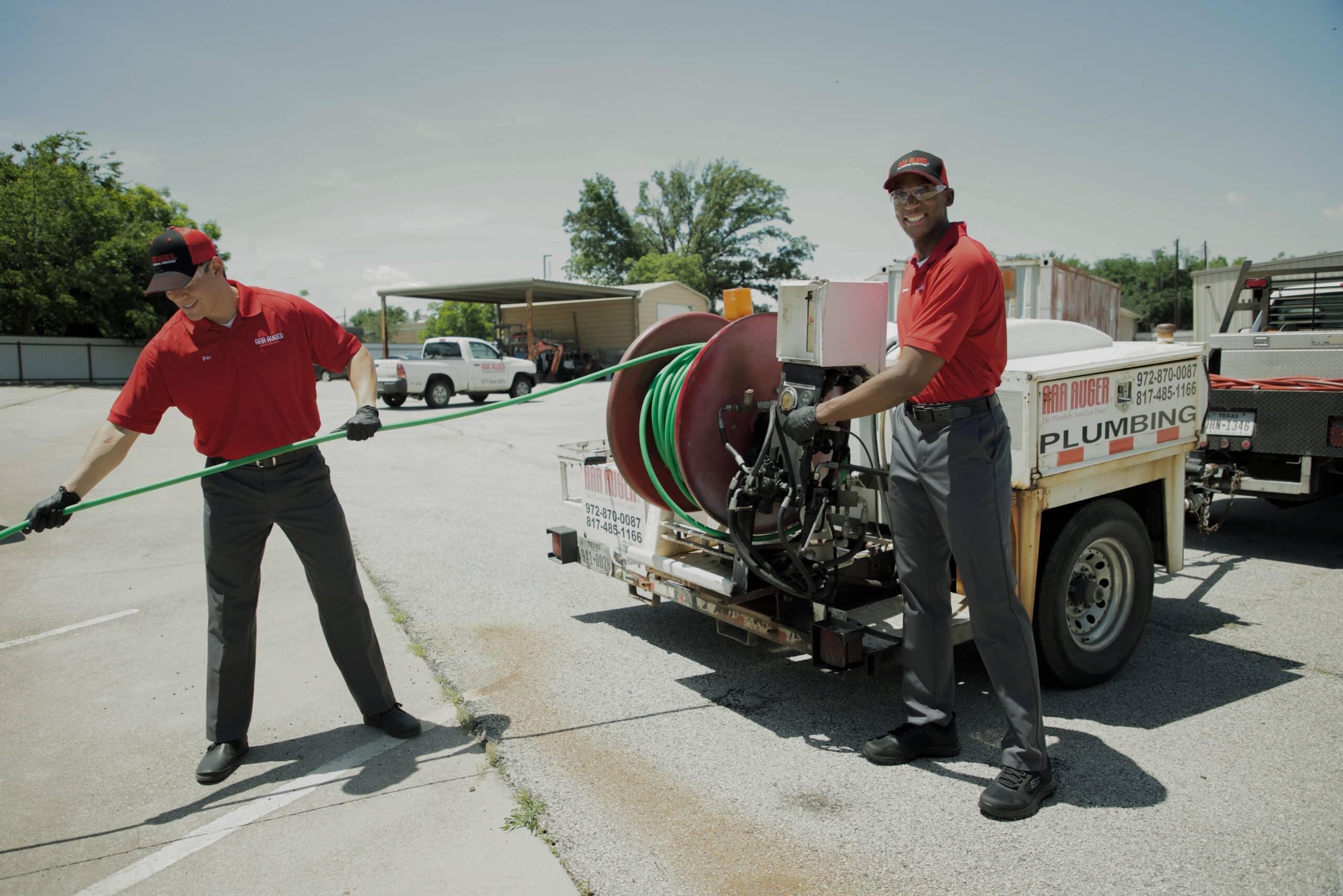 Two Plumbers Working Together Image